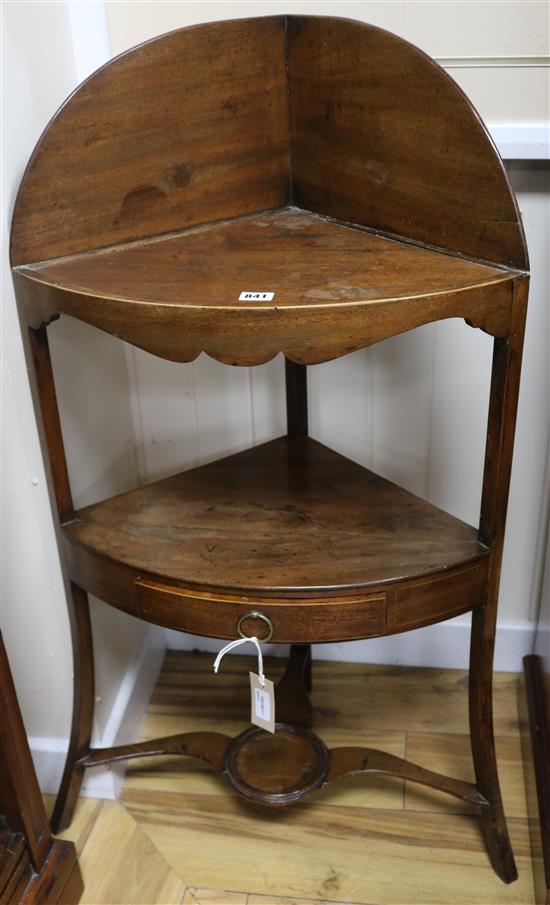 A George III boxwood line-inlaid three-tier corner washtand, bow-fronted, with tray top and drawer, H.102cm